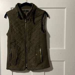 Women’s small green quilted vest.